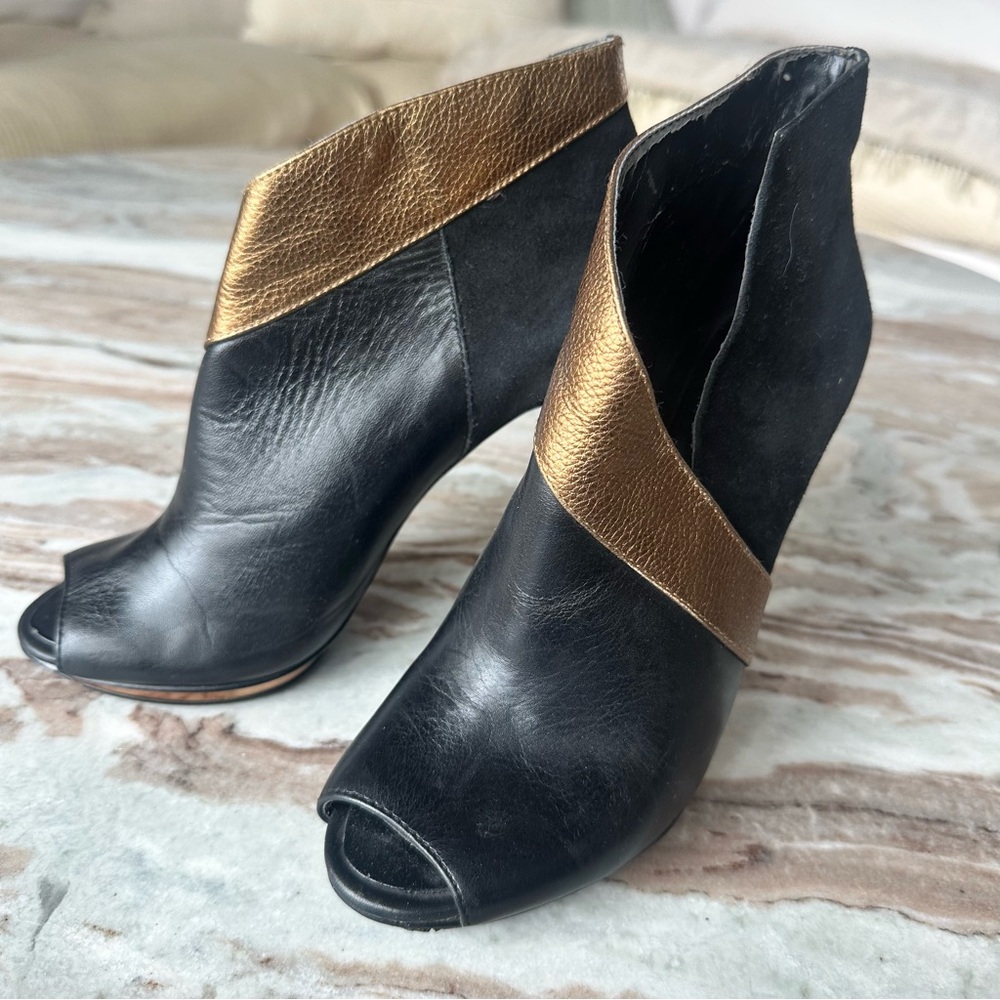 Chic Black and Gold Heeled Boots with Peep-Toe